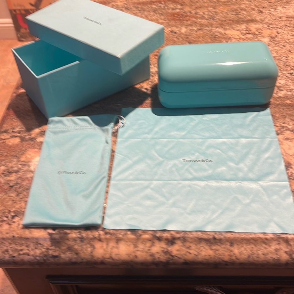 Tiffany sunglasses case with original box, cloth, and fabric case.